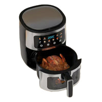 Digital air fryer with a roasted chicken inside on a white background